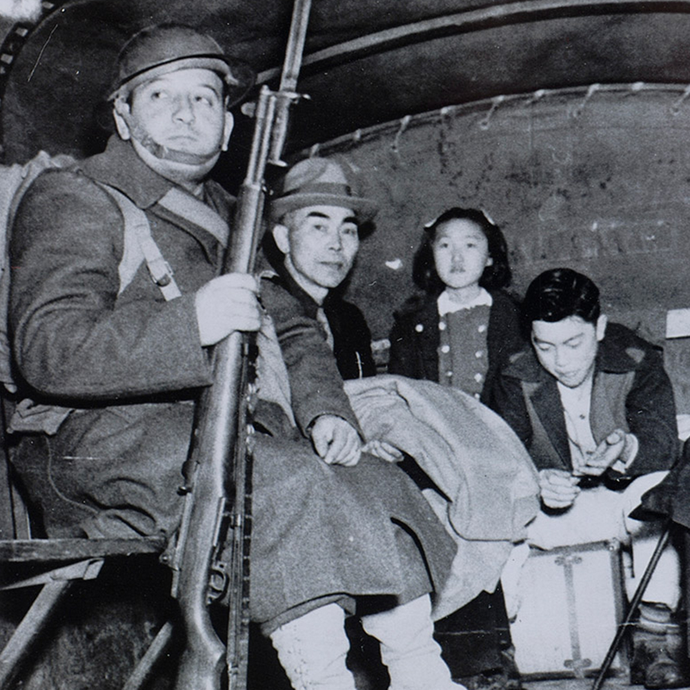 The Nakamuras being taken away