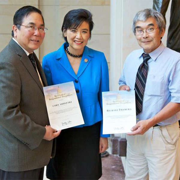 Cory Shiozaki and Richard Imamura receiving the Certificate of Congressional Recognition