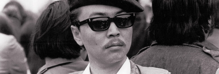 Richard Aoki with beret and sunglasses