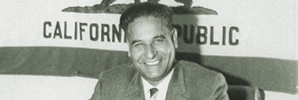 Dalip Singh Saund in front of the California flag