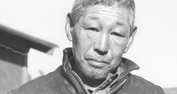 Heihachi Ishikawa with a stringer of golden trout in 1945, photo by Toyo Miyatake