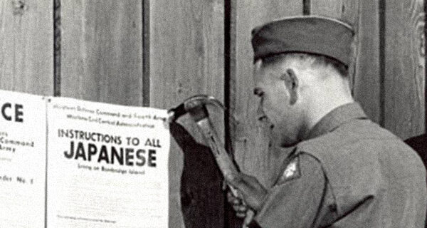 Civilian Exclusion Order No.1 being posted. Courtesy of the Library of Congress