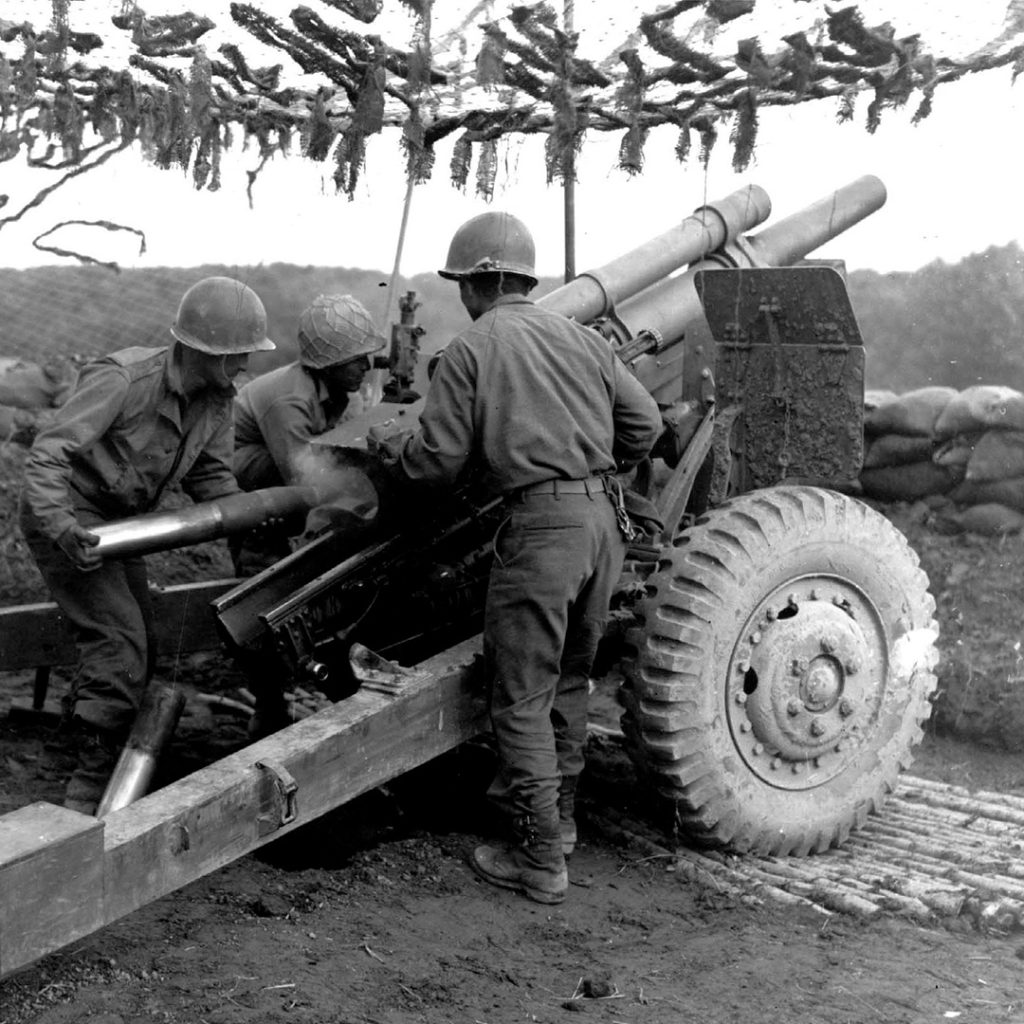 522nd Field Artillery Battalion throwing 105mm shells at Germans in Bruyéres Sector, France
