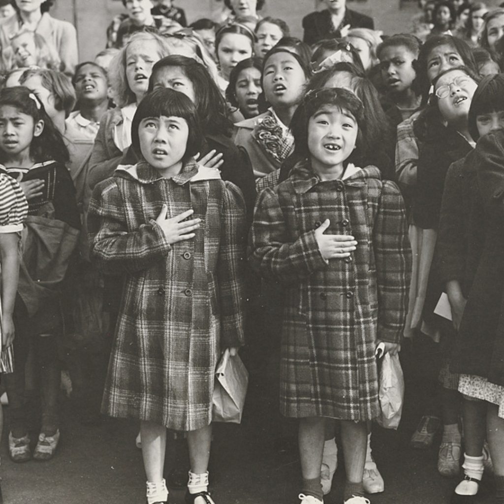 Children of the Weill public school in a flag pledge ceremony, San Francisco, CA, 1942, photo by Dorothea Lange