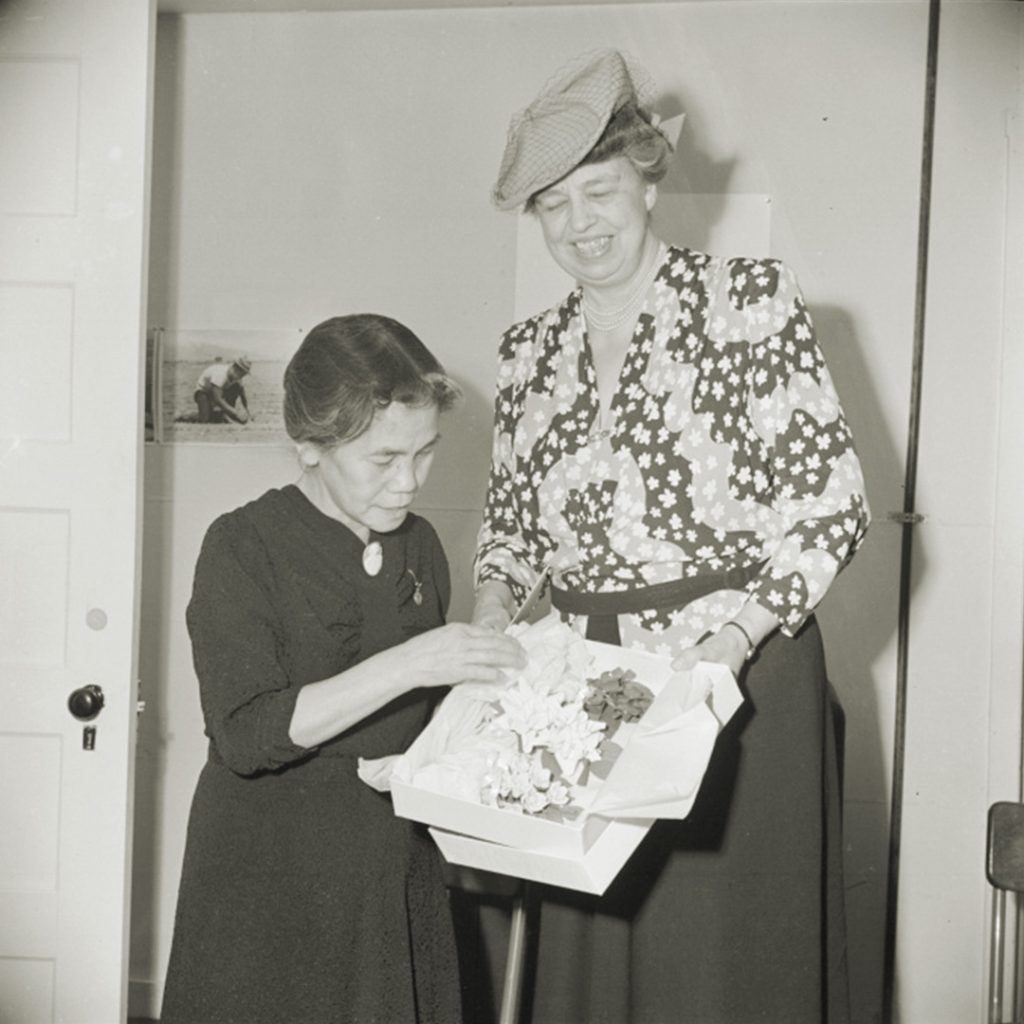 Mrs. Yamamoto giving flowers