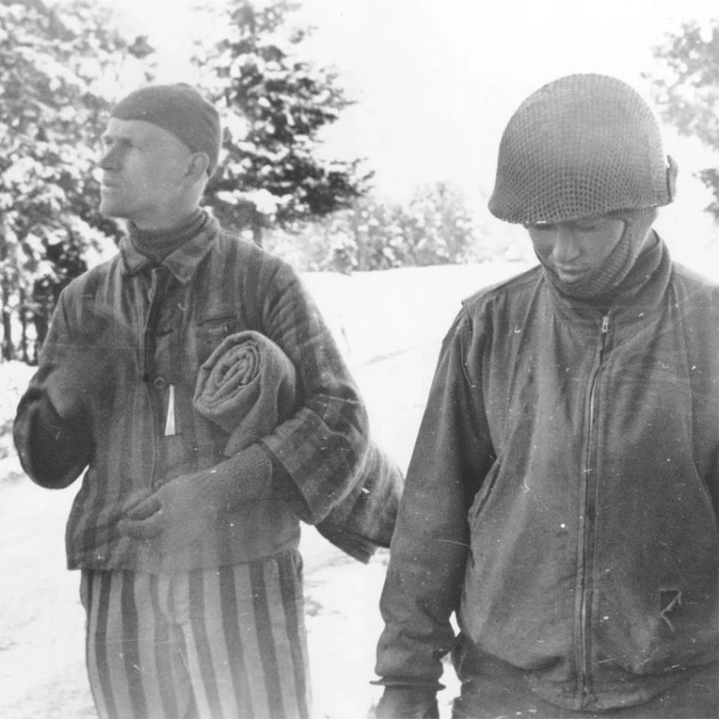Tahae Sugita of the 522nd Field Artillery Battalion with camp survivor, Dachau, Germany, credit USHMM