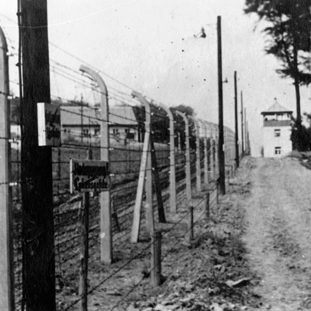 Watch tower and electric fence, Dachau, Germany