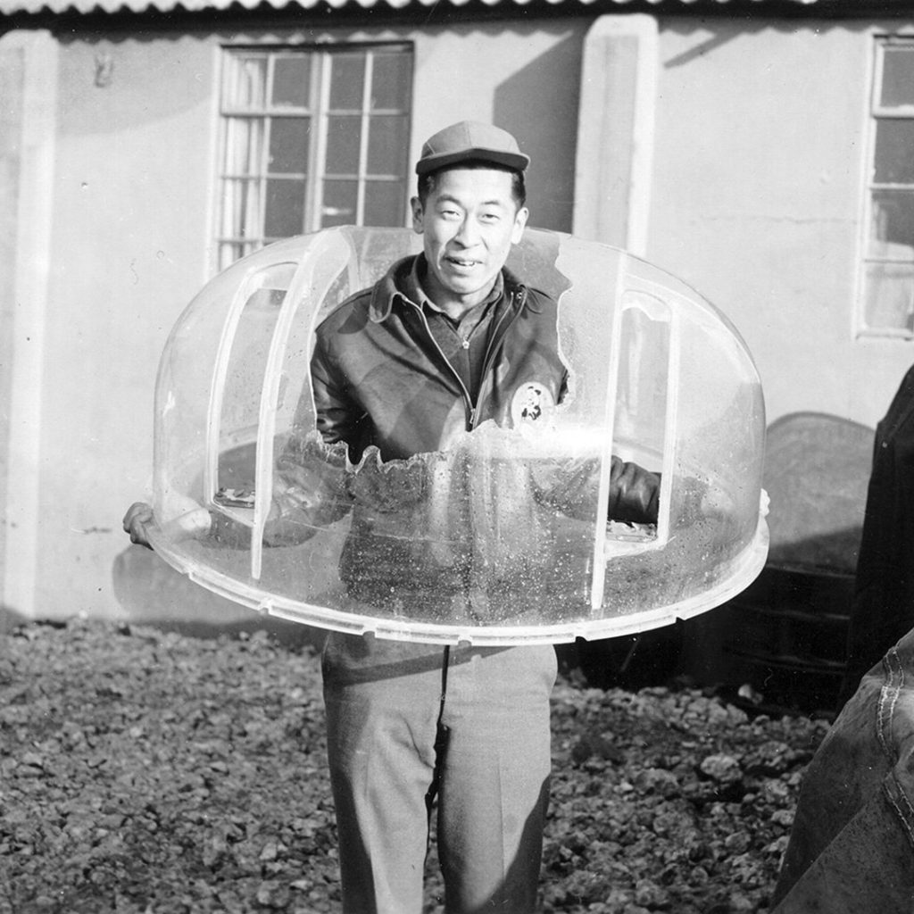 Ben Kuroki holding a shattered plexiglass turret when he was almost killed, credit Jean Lukesh