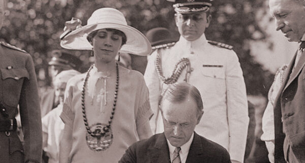 President Calvin Coolidge signing the Immigration Act on the White House South Lawn