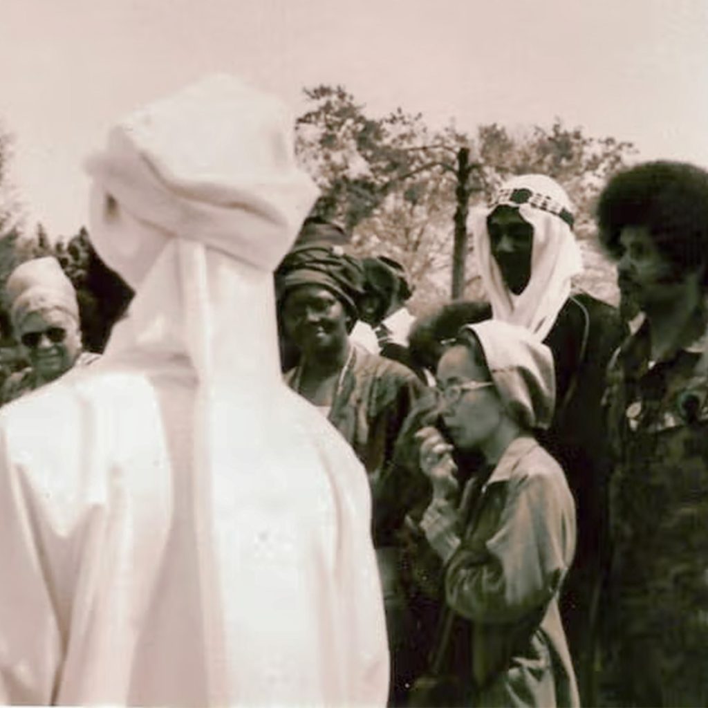 Yuri Kochiyama speaking at a Malcolm X commemoration event at his grave site in New York, credit Kochiyama Family/UCLA Asian American Studies Center