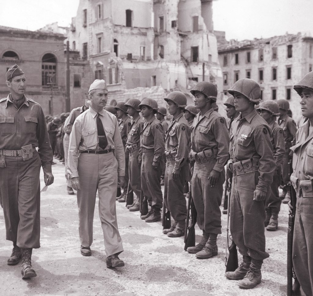Lieutenant General Mark Clark and C.G. Fifth Army and Secretary of the Navy James Forrestal inspect troops from the 100th Infantry Battalion, Leghorn, Italy, courtesy of Seattle Nisei Veterans Committee and the US Army