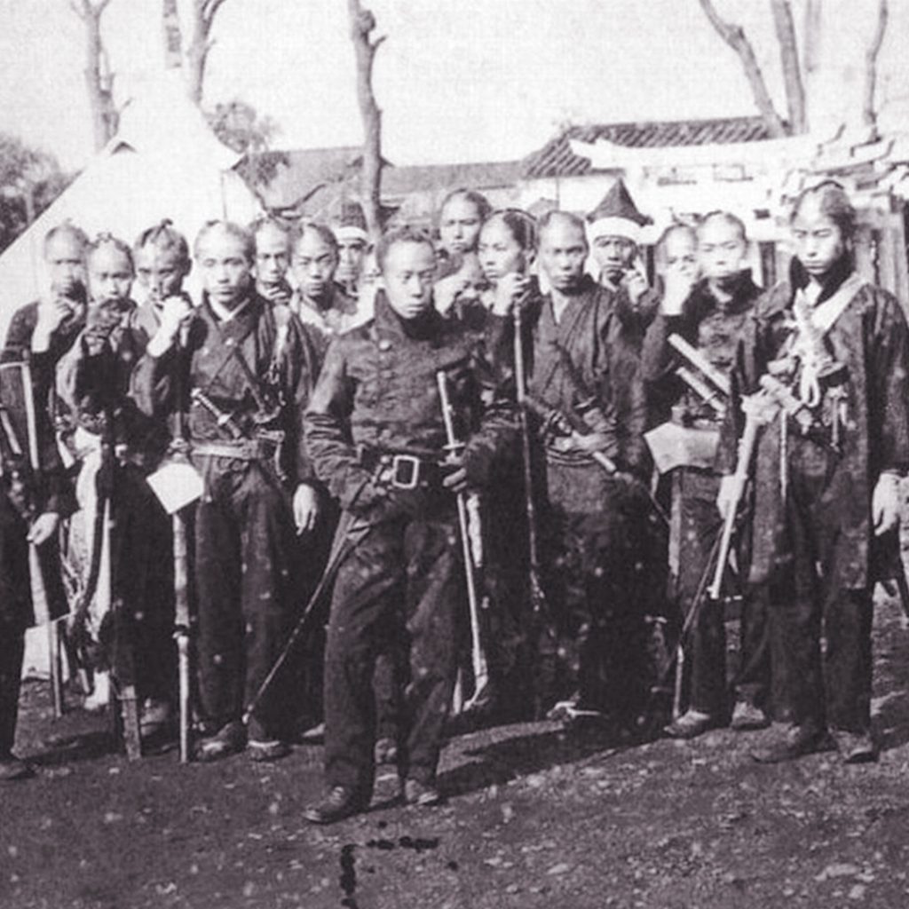 Soldiers of the Tokugawa Shogunate for the Boshin War – the last samurais, wearing mixture of Western and traditional Japanese elements, c1867