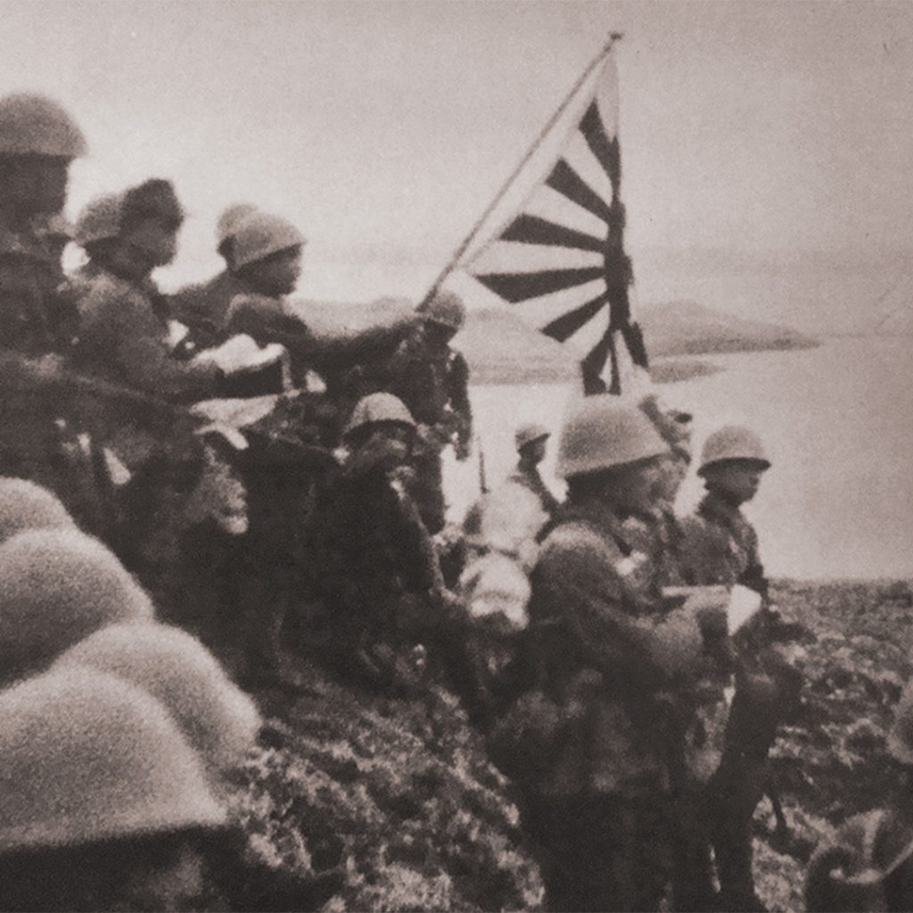 Japanese troops raise the Imperial battle flag, Kiska Island, Alaska, June 6, 1942
