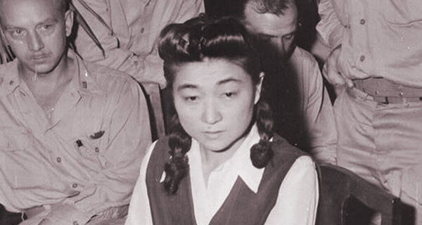 Correspondents interview "Tokyo Rose" Iva Toguri, American-born Japanese. September 1945. (Navy)