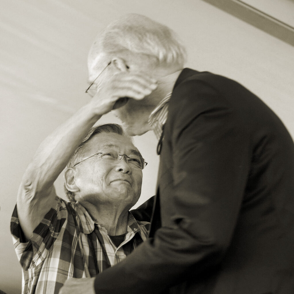 Norman Mineta and Alan Simpson hugging at the annual Heart Mountain Pilgrimage