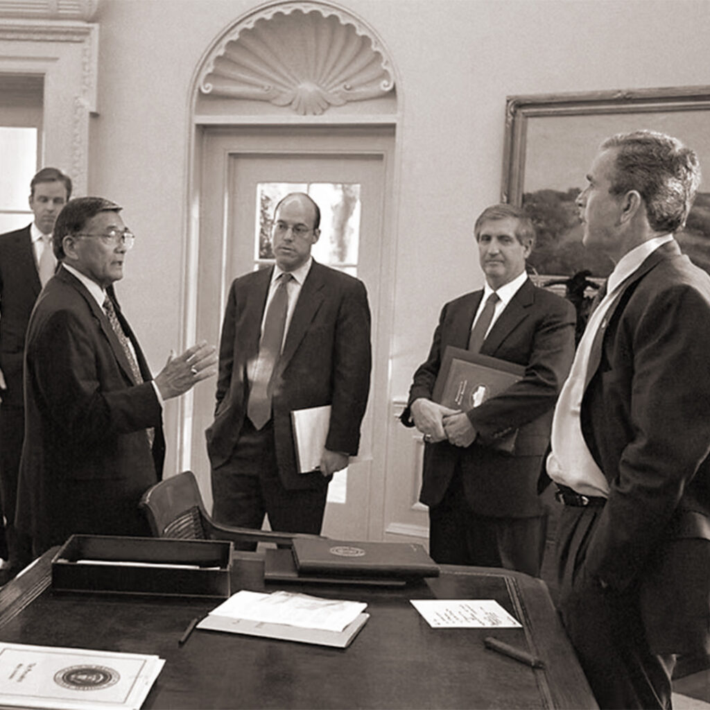 Secretary Mineta speaking to President George W. Bush