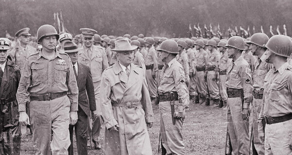 President Truman walks past members of the 442nd Regimental Combat Team as they stand at attention on the Ellipse, Washington DC, July 14, 1946