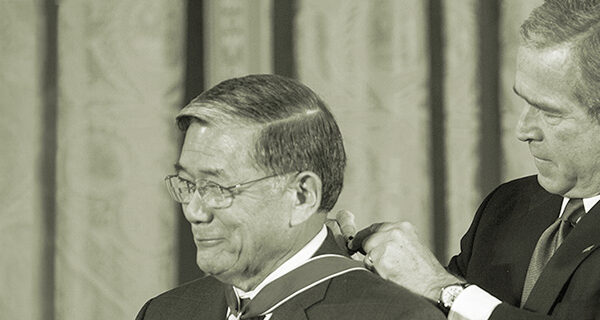 Secretary Norman Y. Mineta receiving the Presidential Medal of Freedom from President George W. Bush, December 15, 2006