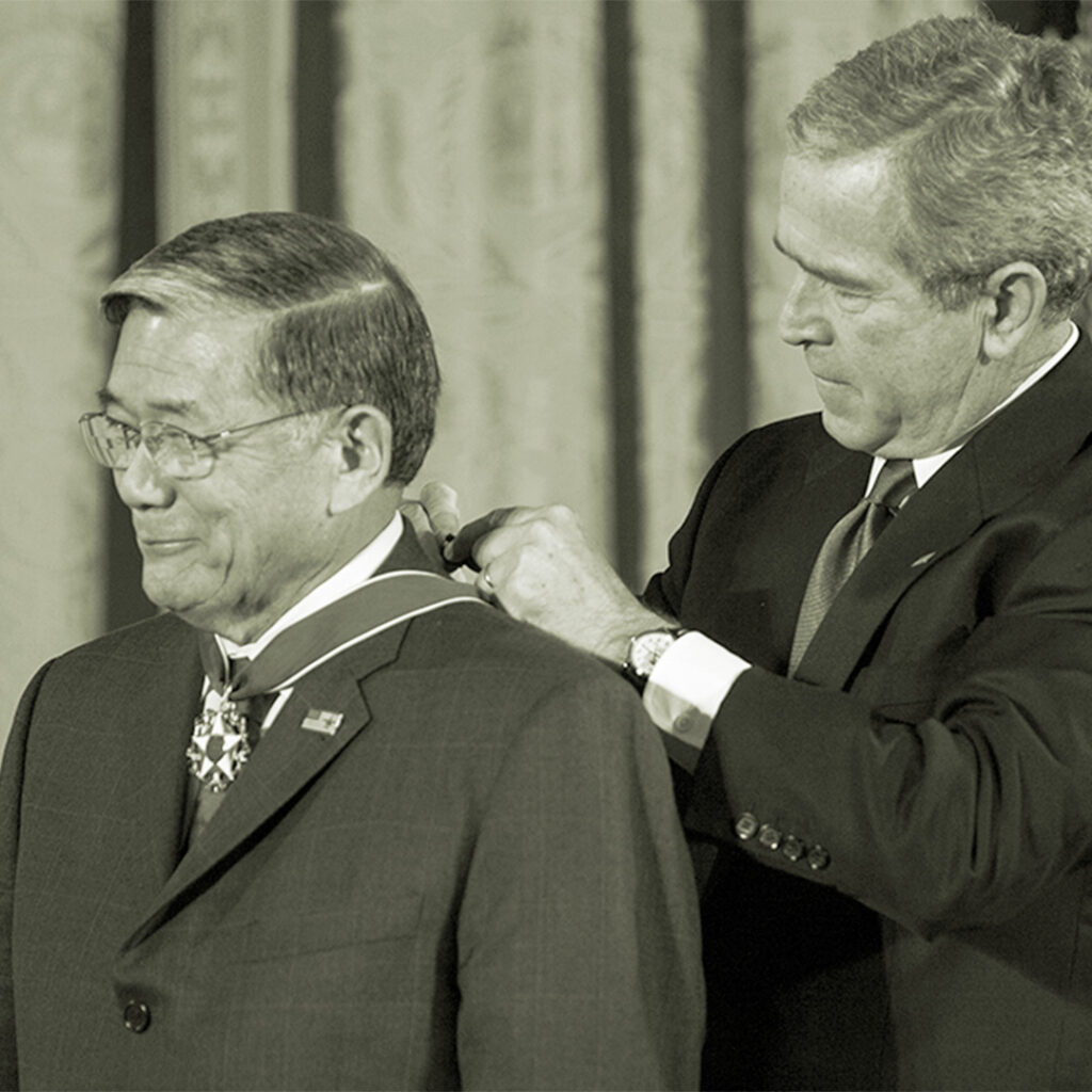 President George W. Bush presents Norman Y. Mineta with the Presidential Medal of Freedom Dec. 15, 2006, during ceremonies in the East Room of the White House. Photo by Eric Draper, Courtesy of the George W. Bush Presidential Library and Museum
