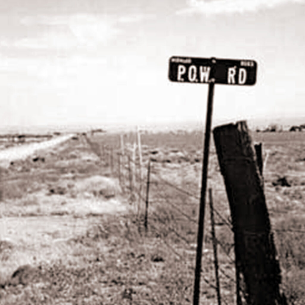 Fencing and signage leading to Camp Lordsburg, credit National Park Service Archives