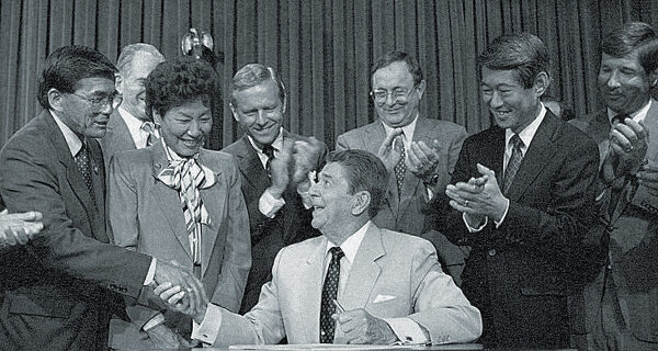 President Ronald Reagan shaking hands with Representative Norman Mineta of California, credit Ronald Reagan Presidential Library and Museum/NARA