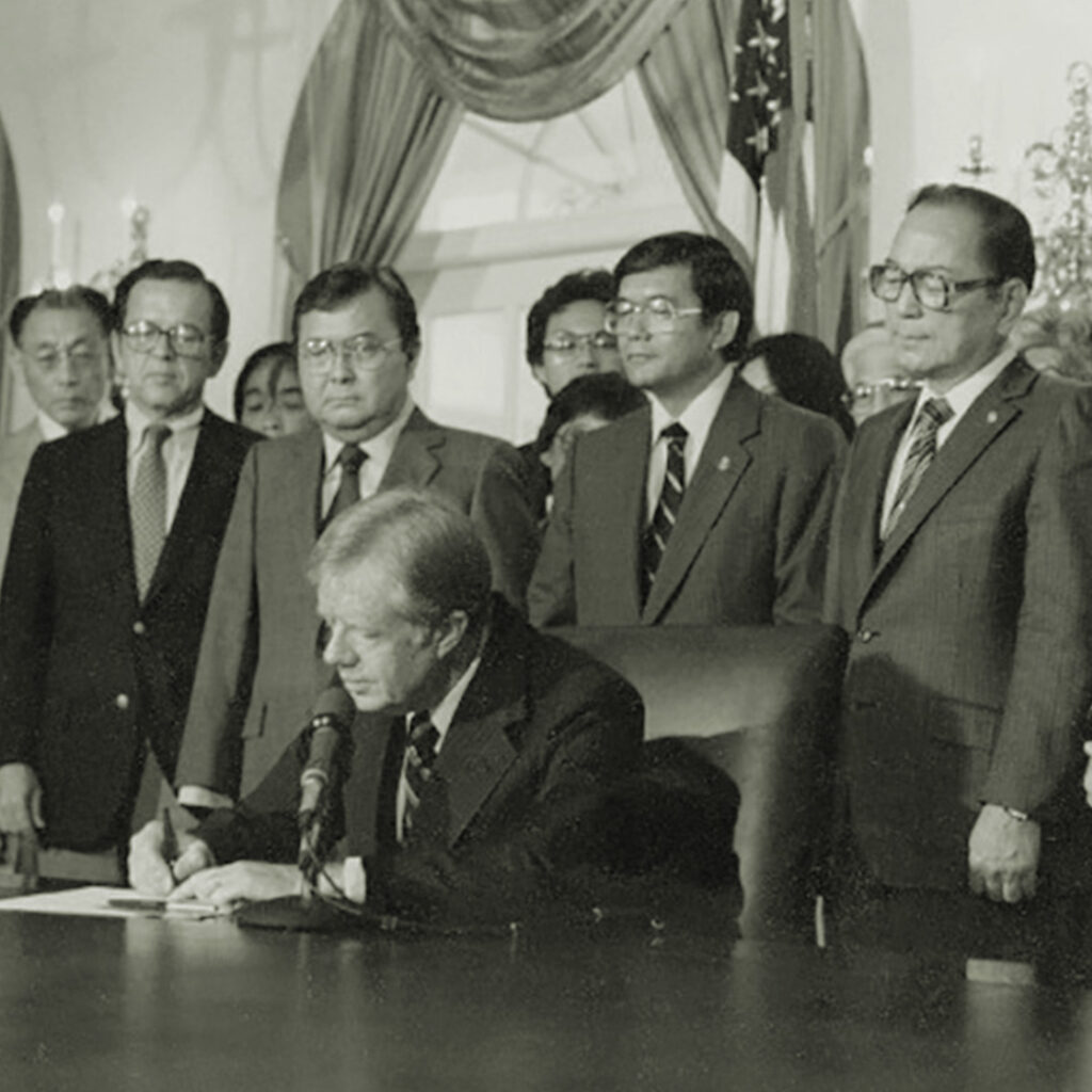 President Jimmy Carter signing the legislation establishing the Commission on Wartime Relocation and Internment of Civilians (CWRIC) on July 31, 1980, credit National Archives