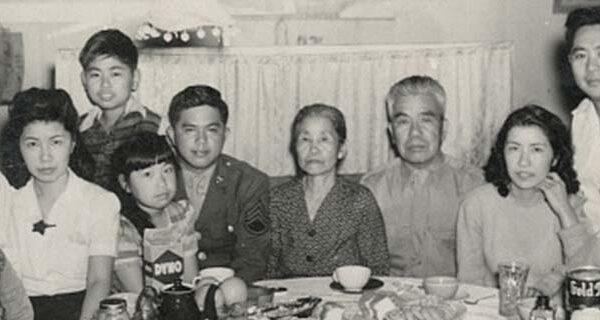 Kazuo Masuda visiting his family during his furlough, Jerome Relocation Center