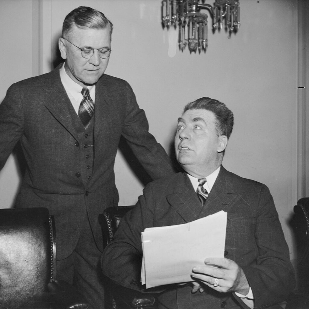 Carr’s 1942 Senate opponent, Edwin Johnson (seated), pictured with his attorney J. Haden Alldredge.