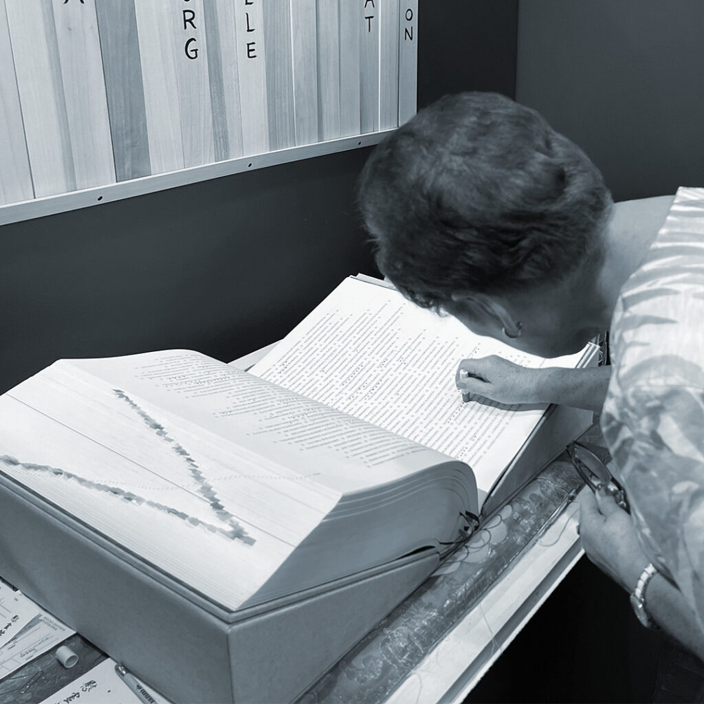 A woman stamping the Ireicho. Photo by Phil Mimaki.