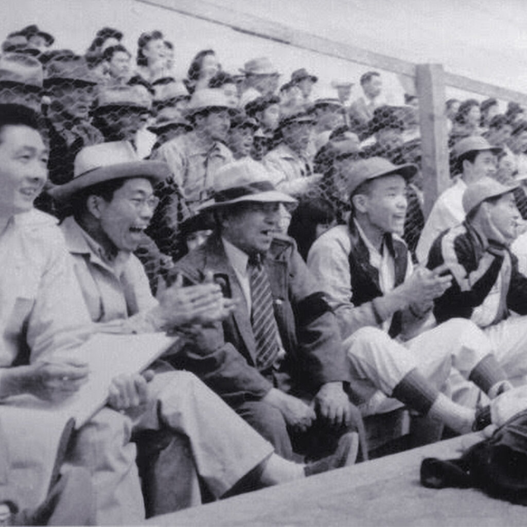 Gila River baseball fans cheering from the stands during the incarceration, photo courtesy of Kerry Nakagawa