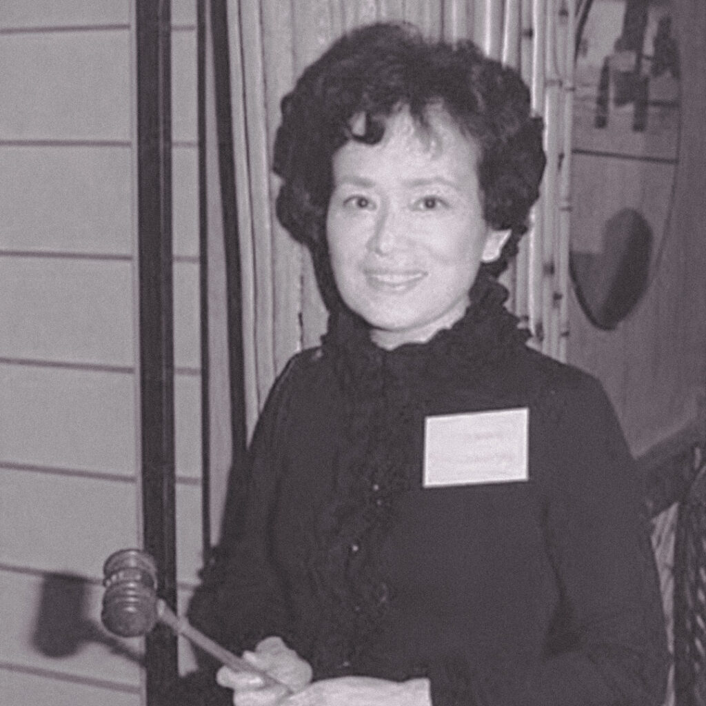 Cherry Kinoshita, newly elected president of the Seattle JACL in 1977, holding the gavel