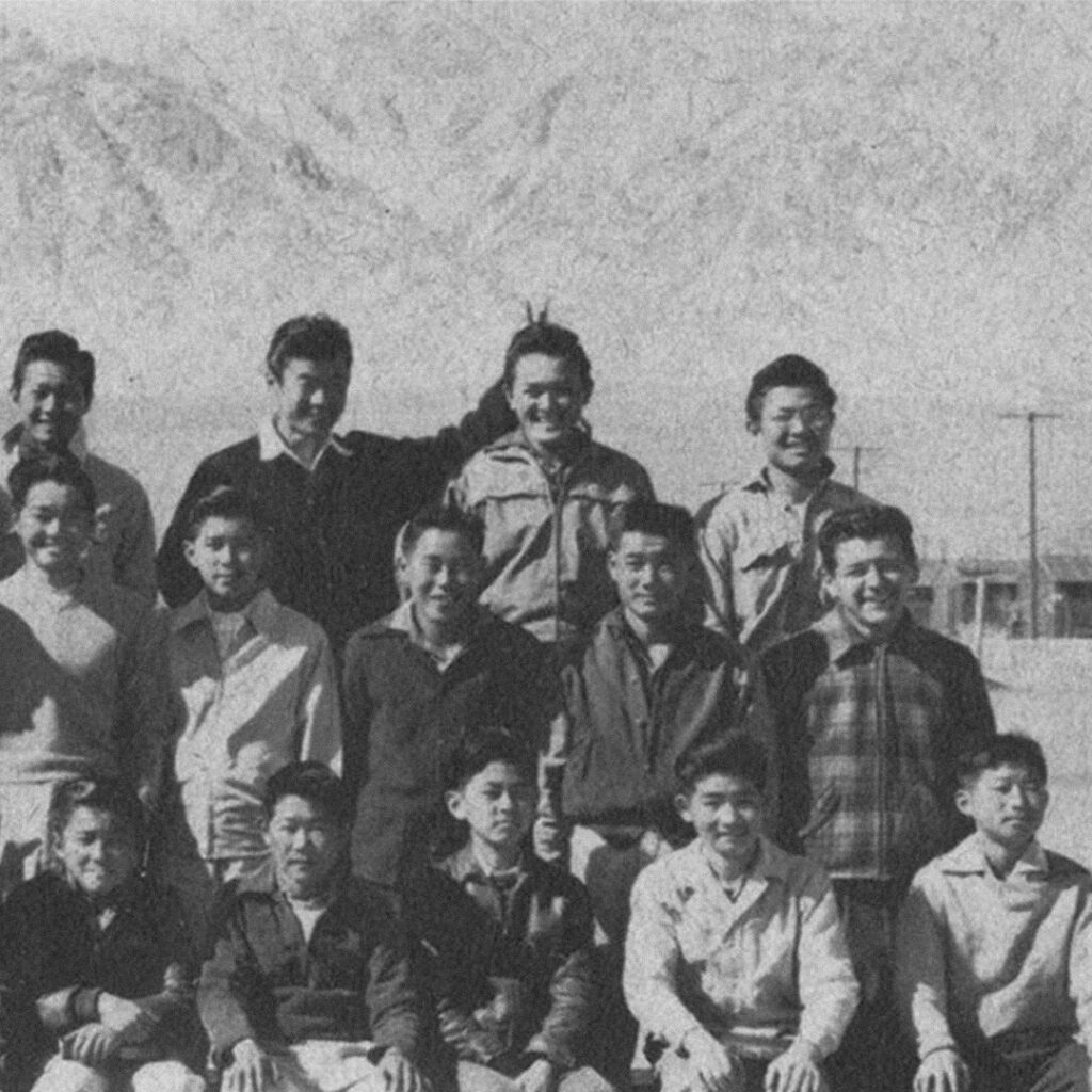 Ralph Lazo with a group of incarcerees at Manzanar.
