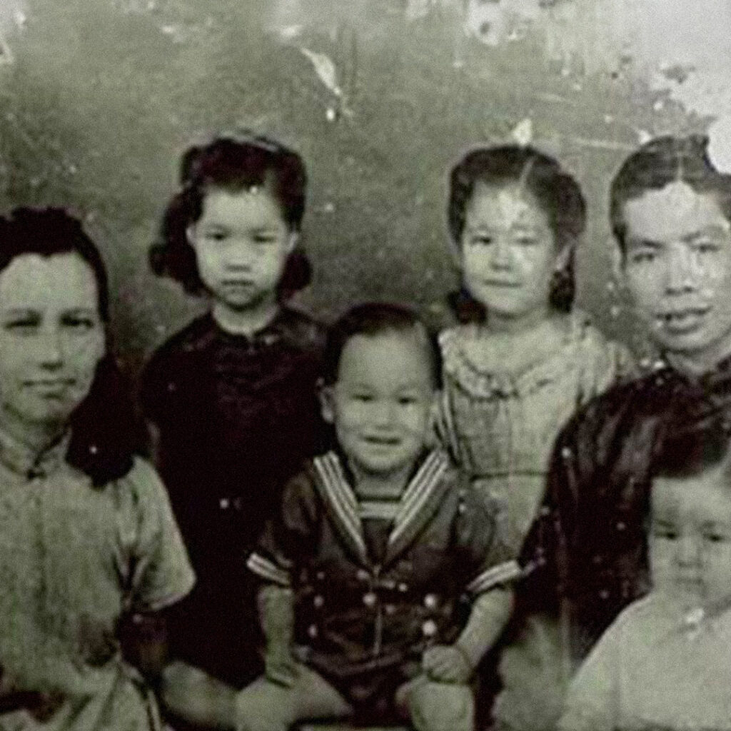 Bruce Lee as a baby with his parents and siblings.