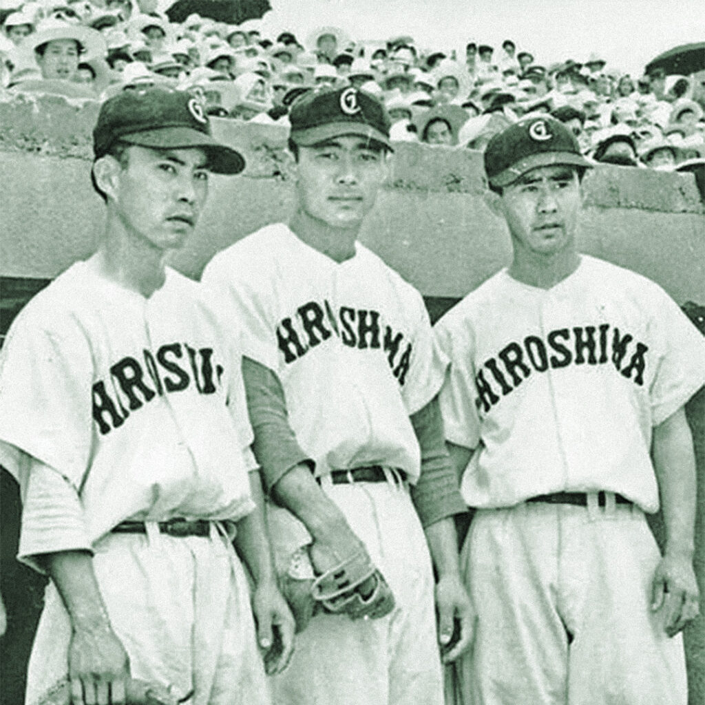 Howard Zenimura (left) and Harvey Zenimura (right), sons of Kenichi “Zeni” Zenimura, playing for the Hiroshima Carp baseball team in postwar Japan.