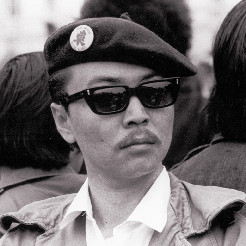 Richard Aoki in the Black Panther Party’s signature beret and sunglasses.