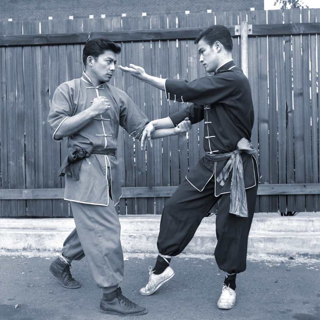 Bruce Lee training with Taky Kimura, one of his closest students.