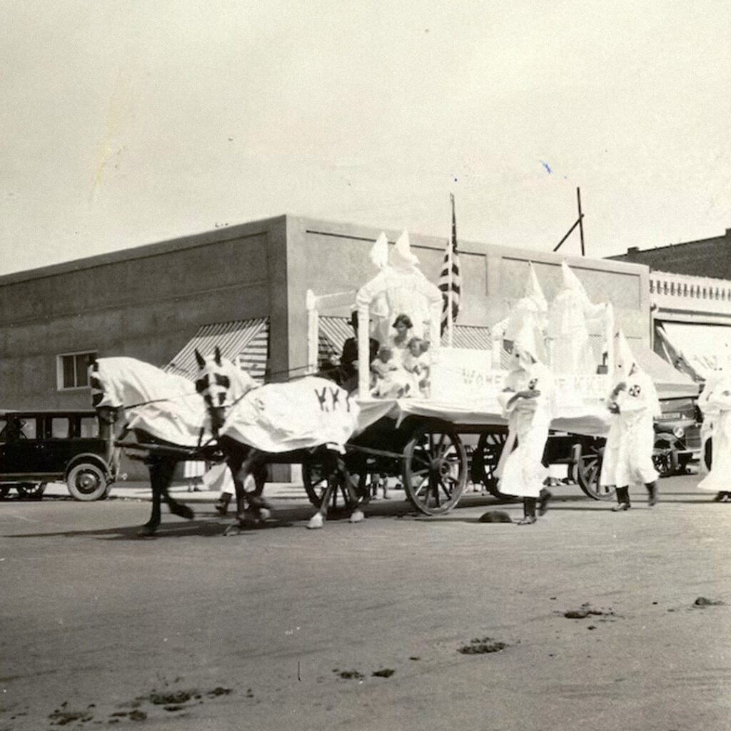 Ku Klux Klan members parade openly through town streets of Grants Pass, Oregon, 1920s