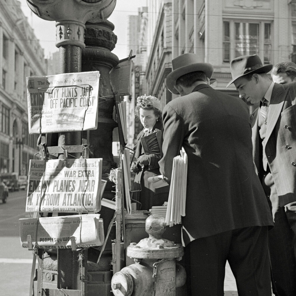 People buying newspapers. San Francisco, December 8, 1941.