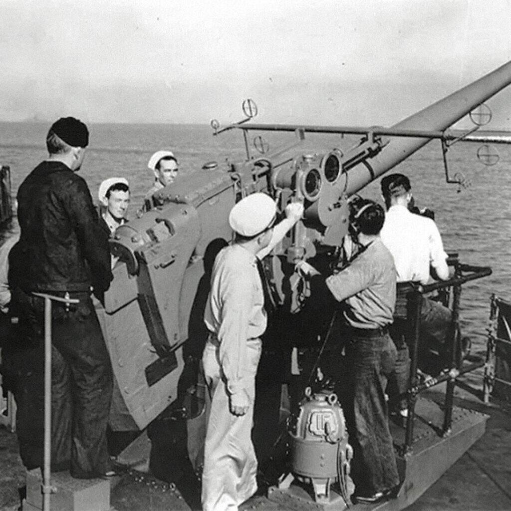 U.S. Navy sailors operating a 5-inch anti-aircraft gun, 1942. Credit WikiMedia Commons