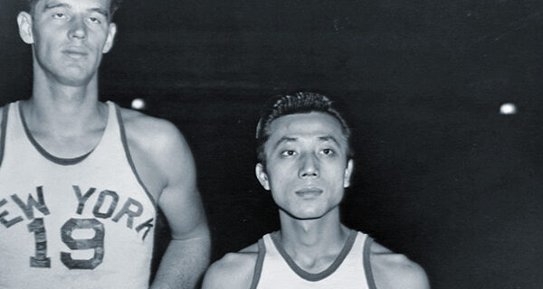 New York Knickerbockers' Wat Misaka standing next to Lee Knorek
