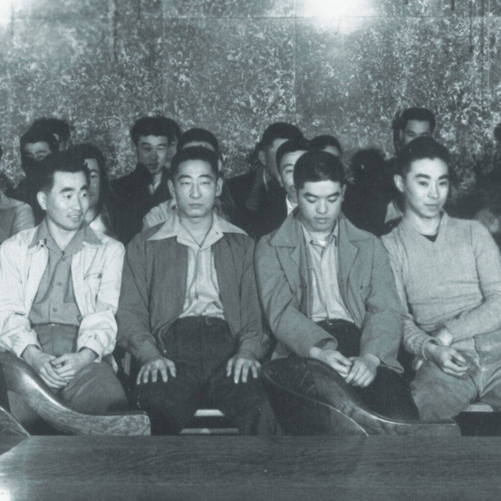 63 members of the Heart Mountain Fair Play Committee during the first day of the trial in Federal District Court, Cheyenne, Wyoming, 1944, credit Frank Emi