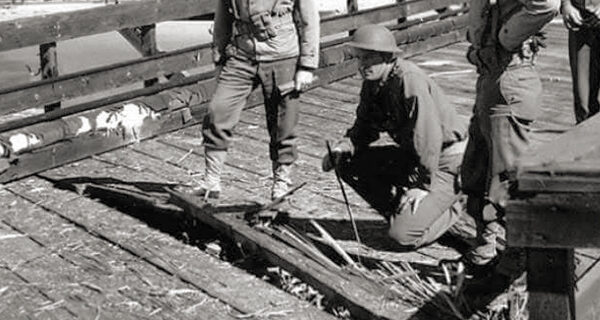 soldiers inspecting the splintered decking at Ellwood oil pier