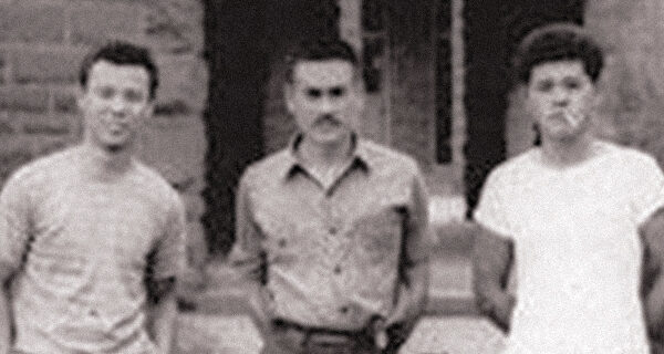 Three of the five inmates of Old Leupp Isolation Center outside the old boarding school, 1943