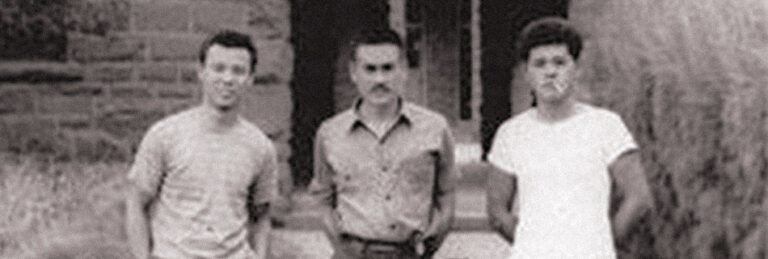 Three of the five inmates of Old Leupp Isolation Center outside the old boarding school, 1943