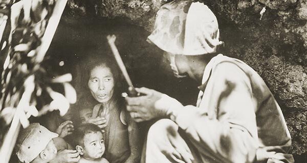 A member of a Marine patrol on Saipan found this family of Japanese civilians hiding in a hillside cave. June 21, 1944 - NARA - 532380