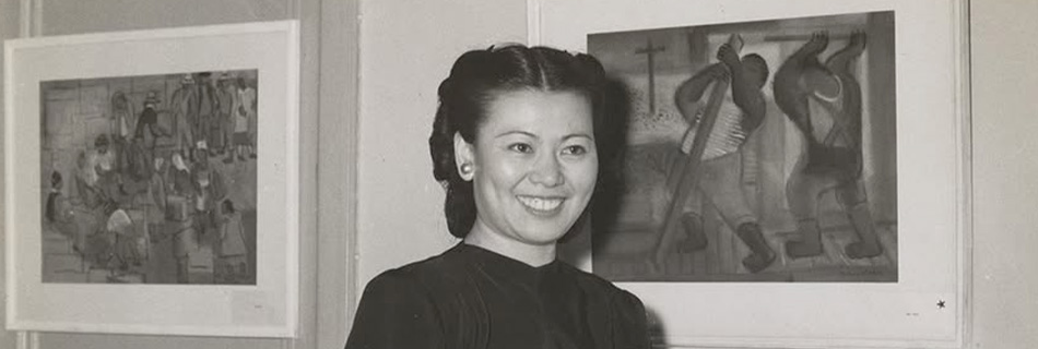 Mine Okubo standing by her art, courtesy of UC Berkeley, Bancroft Library