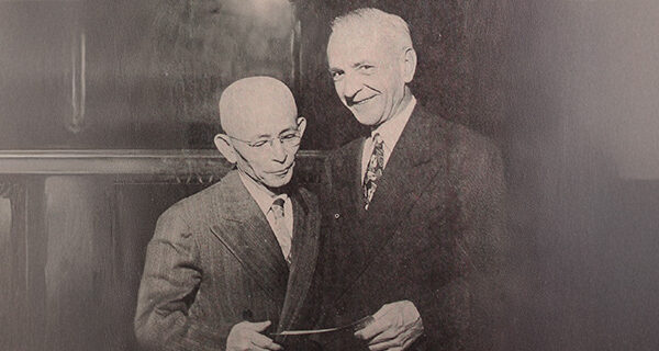 the first evacuation claims check presented to Tokuji Tokimasa by Claims Agent William H. Jacobs, photo by Jack Iwata. Courtesy of the Japanese American National Museum