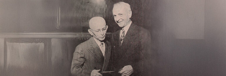 the first evacuation claims check presented to Tokuji Tokimasa by Claims Agent William H. Jacobs, photo by Jack Iwata. Courtesy of the Japanese American National Museum