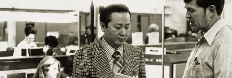 Morris Chang talking to a production line supervisor at Texas Instruments