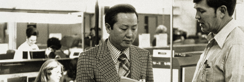 Morris Chang talking to a production line supervisor at Texas Instruments